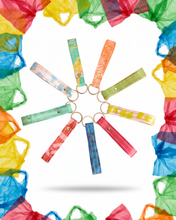 Load image into Gallery viewer, Handcrafted recycled plastic keychain made from 7 colorful plastic bags, showcasing unique upcycled texture. Perfect sustainable corporate gift and ESG merchandise.