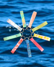 Load image into Gallery viewer, Malaysian-made recycled plastic keychain, upcycled from 7 plastic bags. Perfect sustainable corporate gift in Malaysia for ESG initiatives and eco-friendly branding.